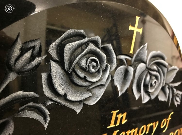 Carved roses in granite with antique finish